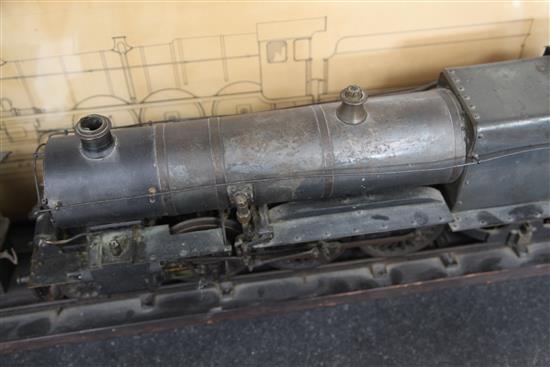 A scratchbuilt model of a 262 steam powered locomotive and tender,